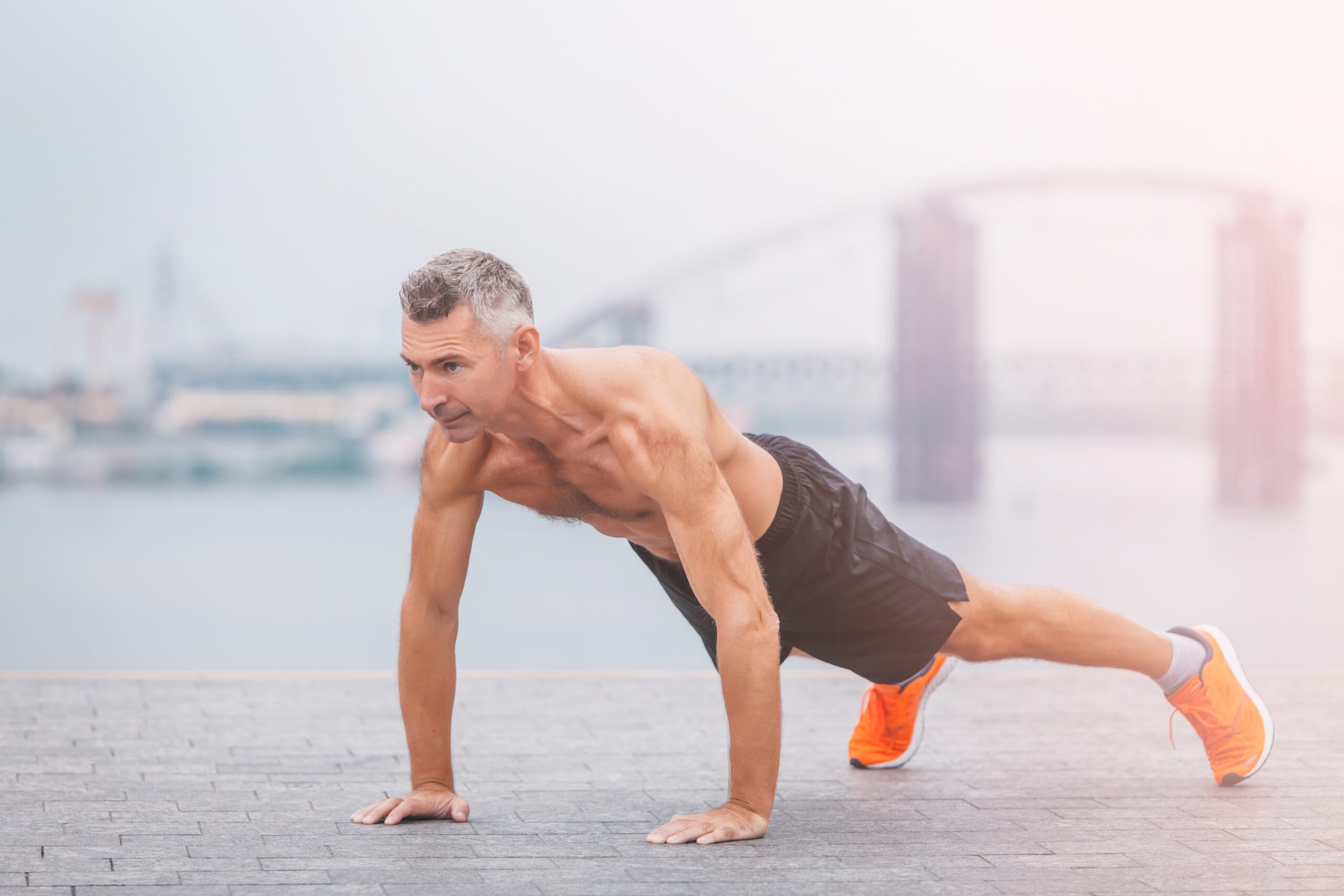 Fitness,Middle,Aged,Man,Doing,Push-ups,On,The,Riverside.,Male